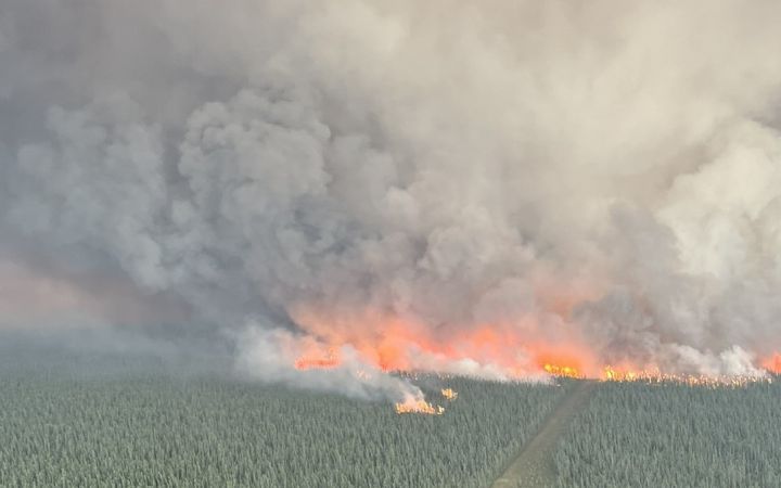 A photo of the The Algar Lake Complex, burning in the Fort McMurray Forest Area in Alberta. This photo was posted by Alberta Wildfire on July 11, 2024.